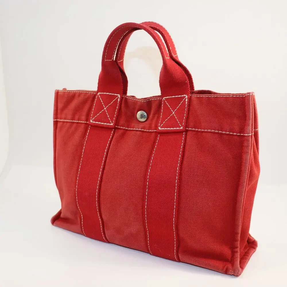 Hermès Red Canvas Small Tote Bag – Classic French Luxury‎ with Snap Closure